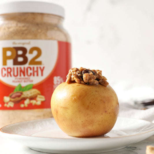 Sweet roasted stuffed apple with PB2 Crunchy Jar in background